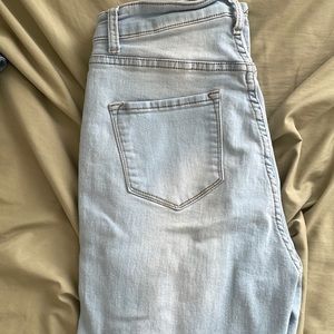 Light wash distressed skinny jeans